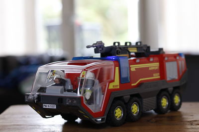 Close-up of toy fire engine on table