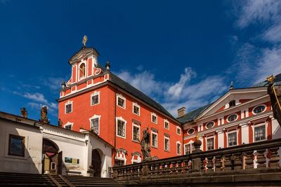 Low angle view of buildings against blue sky