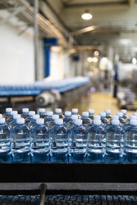 Bottles on conveyor belt at factory