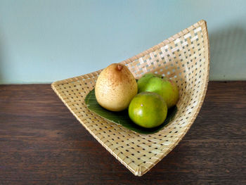 High angle view of apples in container on table