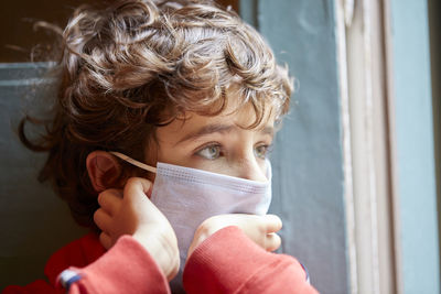 Portrait of boy wearing mask