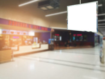 Close-up of illuminated light bulb at airport