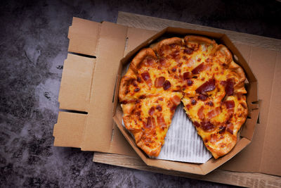 High angle view of pizza in box on table