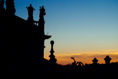 Silhouette church against sky during sunset