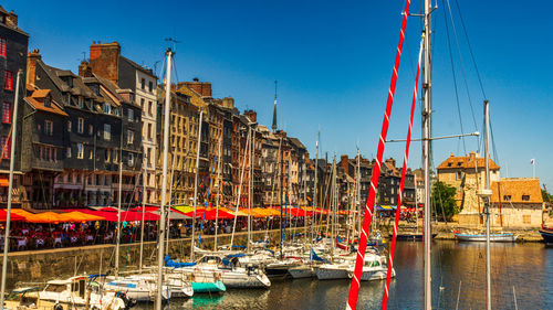 Boats moored at harbor