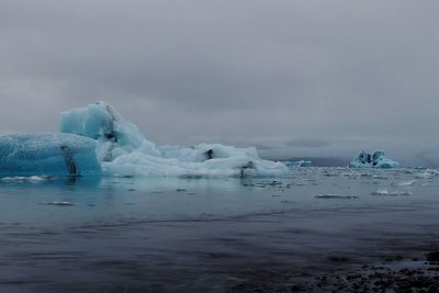 Scenic view of sea against sky during winter