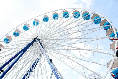 Low angle view of ferris wheel against sky