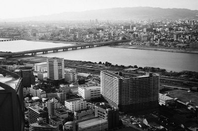 High angle view of buildings and river in city