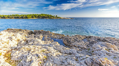 Scenic view of sea against blue sky