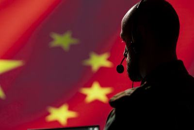 Silhouette woman with arms raised