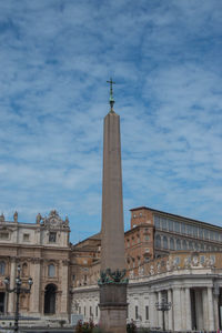 Low angle view of building against cloudy sky