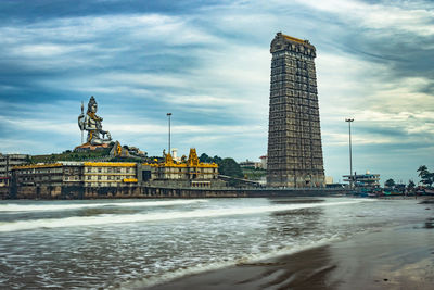Murdeshwar temple early morning view from low angle with sea waves