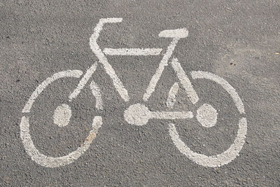 High angle view of road sign on street