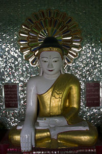 Buddha statue in temple outside building