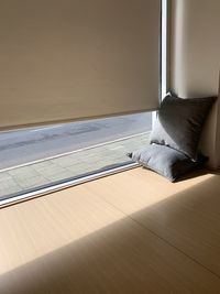 Empty bed by window at home