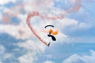 Low angle view of kite flying against sky