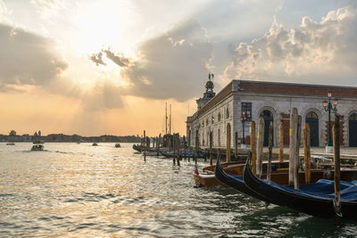 Boats in lake during sunset