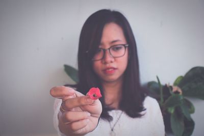 Close-up of young woman with eyeglasses