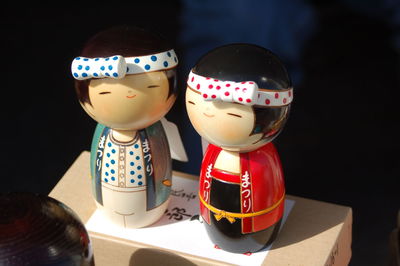 Close-up of kokeshi doll on box