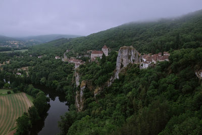 Panoramic view of trees and mountains against sky