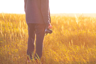 Scenic view of grassy field against sky