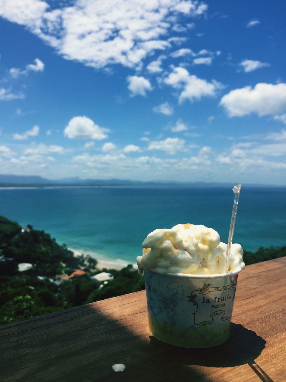 sea, sky, food and drink, water, horizon over water, table, freshness, sweet food, blue, still life, beauty in nature, cloud, nature, cloud - sky, day, food, tranquility, no people, tranquil scene, indulgence