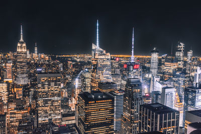 Illuminated buildings in city at night