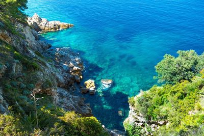 High angle view of sea against blue sky