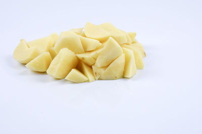 Close-up of fries on white background