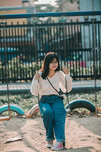 Young woman looking at playground