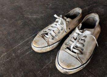 High angle view of dirty canvas shoes