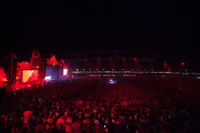 Group of people at music concert at night