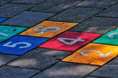 High angle view of colorful hopscotch numbers on street