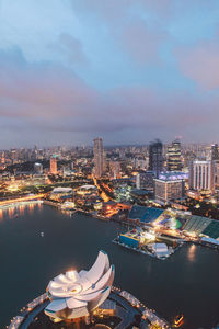 High angle view of artscience museum and cityscape at dusk