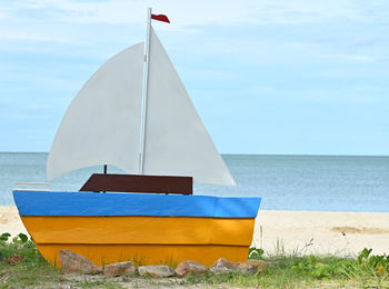 Built structure on beach against sky