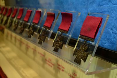 Close-up of cross medals in row