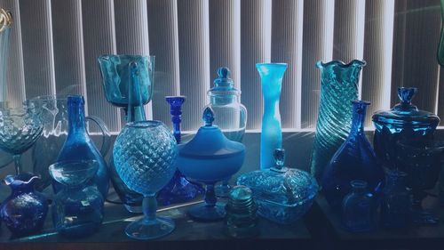 Glass containers in shop seen through window