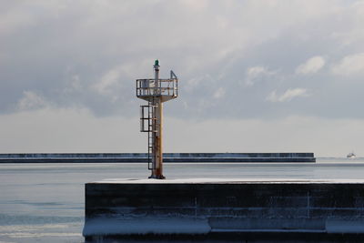 View of communications tower against sky