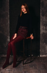 Portrait of woman sitting on seat