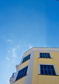 Low angle view of building against blue sky