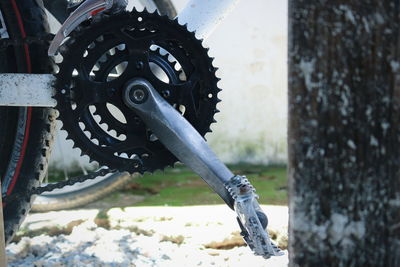 Close-up of bicycle gear on road 