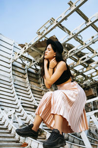 Woman sitting outdoors