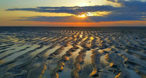 Scenic view of sea at sunset