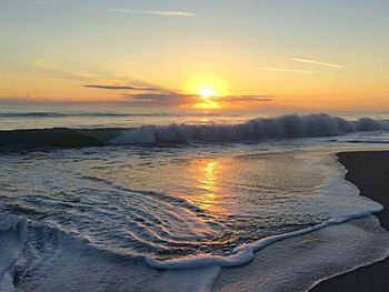 Scenic view of sea at sunset