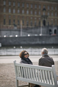 Couple relaxing on bench