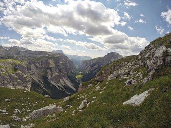 Scenic view of mountains against cloudy sky