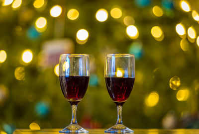 Close-up of wine glasses on table