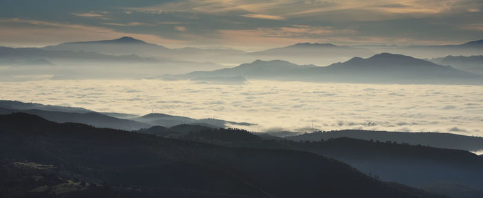 Scenic view of mountains against sky during sunset