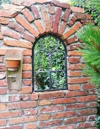 View of window on brick wall