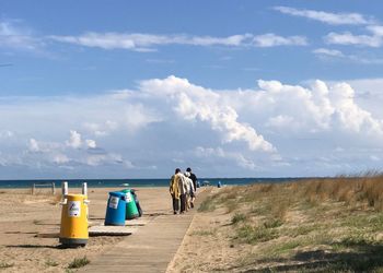 Rear view of people on beach